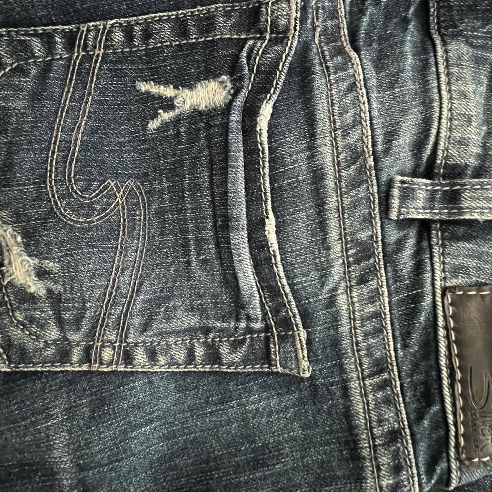 Silver jeans with worn style. Boot cut Suki